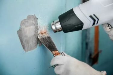 Как убрать старую краску с бетонных стен?